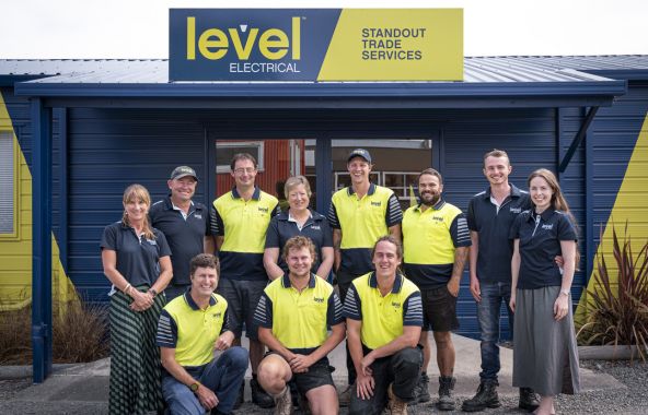 Level Electrical Geraldine & Temuka team standing outside their Geraldine office in branded uniforms