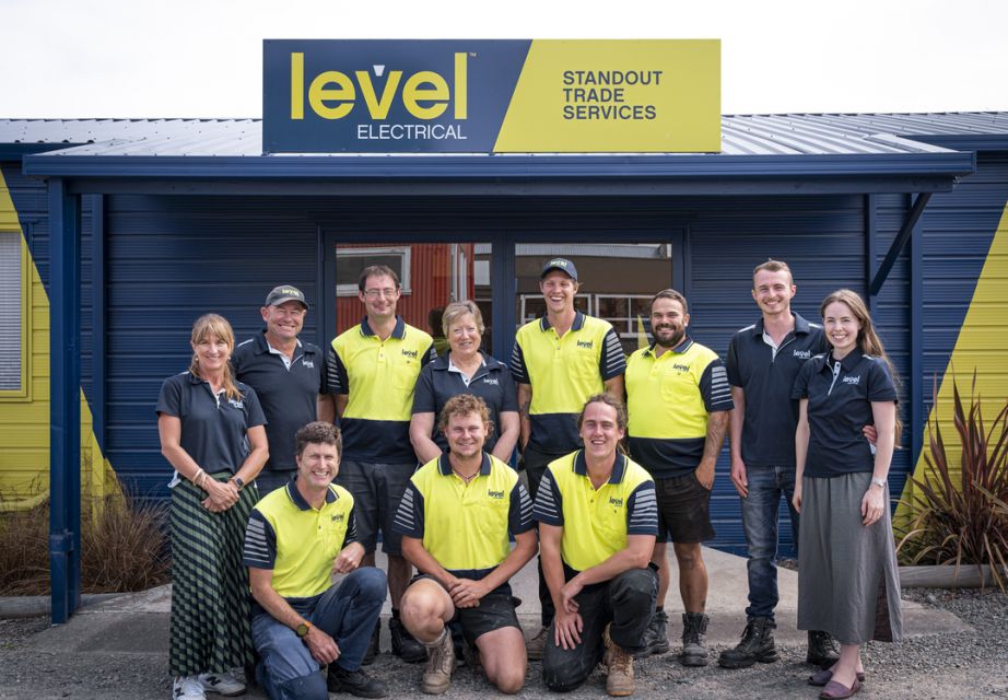 Level Electrical Geraldine & Temuka team standing outside their Geraldine office in branded uniforms