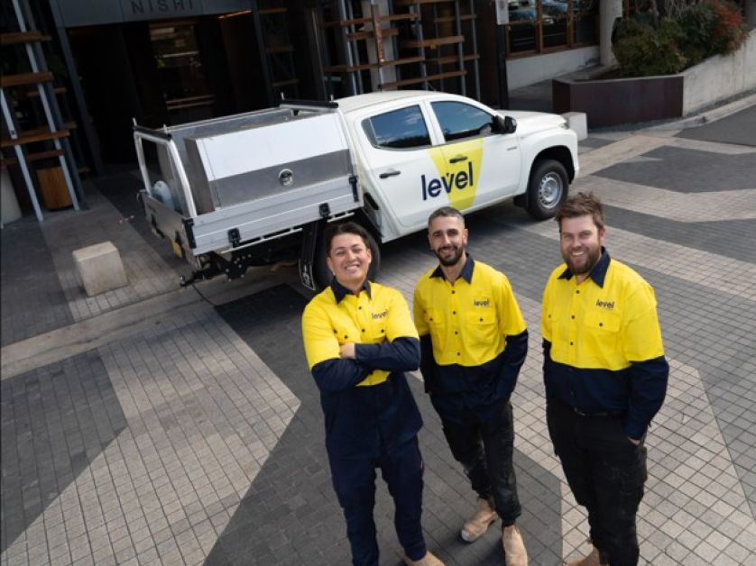 Level Plumbing Canberra team onsite at the Nishi building in Canberra’s NewActon precinct, delivering complex siphonic drainage upgrades for Built using the Geberit roof drainage system.