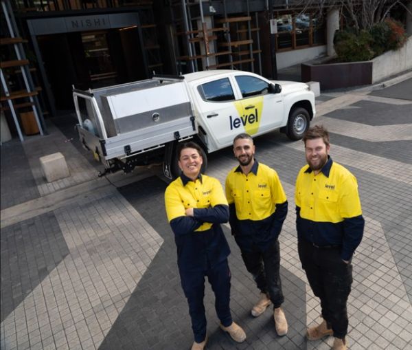Level Plumbing Canberra team onsite at the Nishi building in Canberra’s NewActon precinct, delivering complex siphonic drainage upgrades for Built using the Geberit roof drainage system.