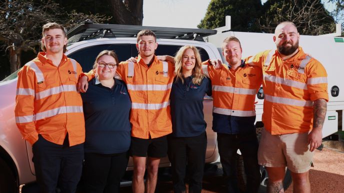 Aleck and Sarah Parry with the Level Plumbing Lithgow team, now part of Level Group ANZ