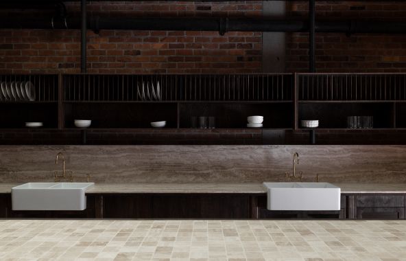 Professional dual farmhouse sink plumbing and tapware installation for a residential or commercial kitchen project completed by licensed plumbers in Howick, Auckland.