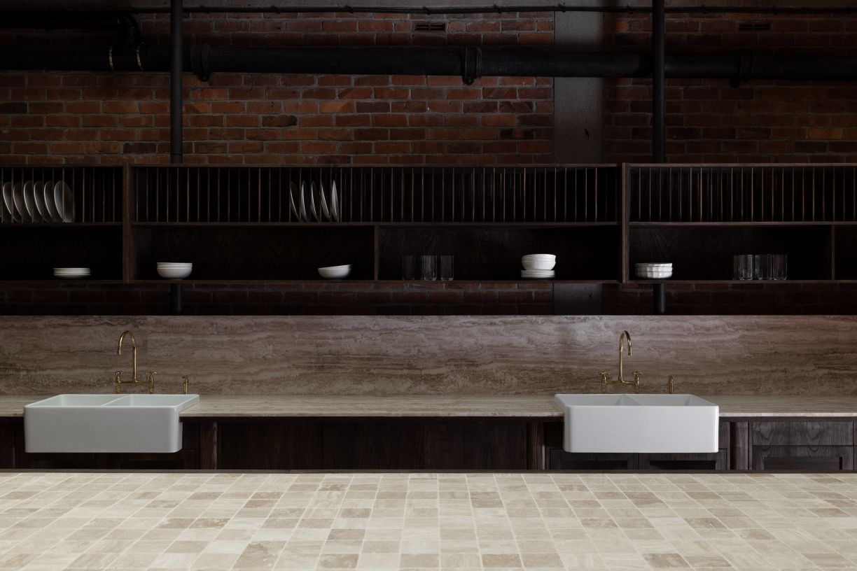 Professional dual farmhouse sink plumbing and tapware installation for a residential or commercial kitchen project completed by licensed plumbers in Howick, Auckland.