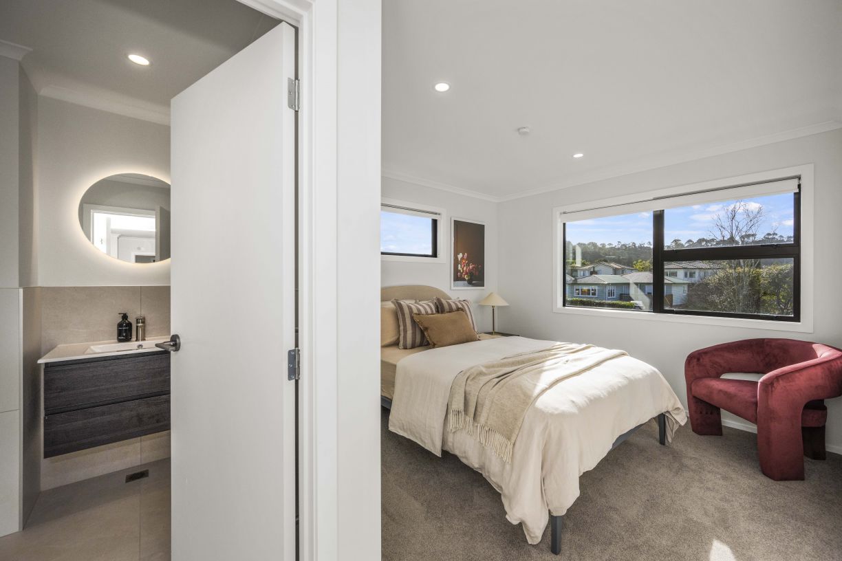 Floating vanity and mirror lighting plumbing installation in a multi-unit residential apartment ensuite