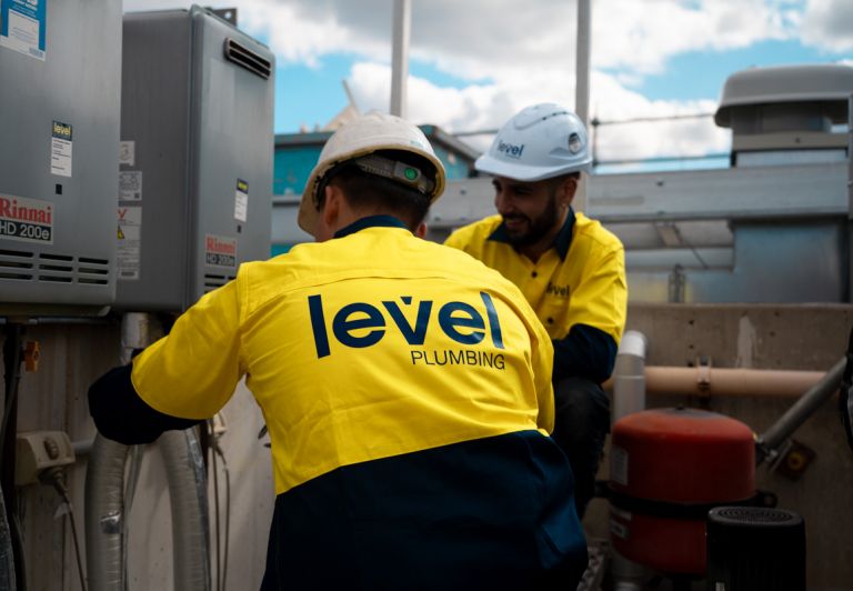 Level Plumbing Howick technicians installing a Rinnai HD 200e continuous flow gas hot water system upgrade