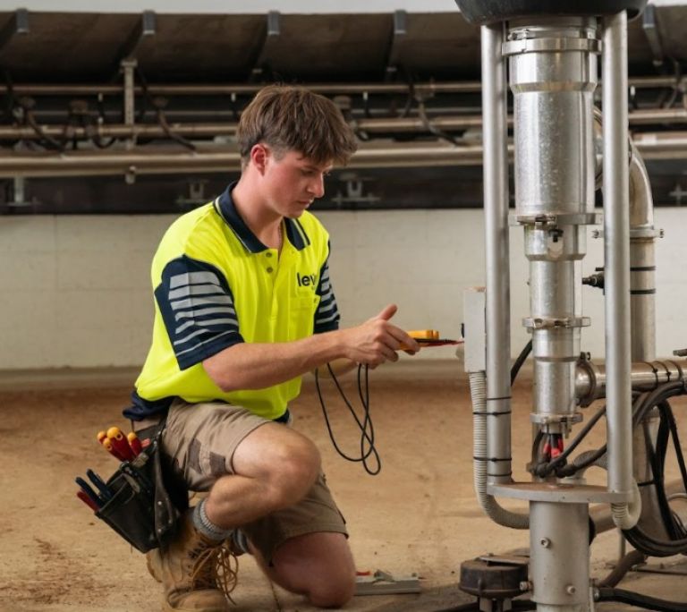 Level Electrical Ashburton technician testing electrical systems at dairy shed in Banks Peninsula