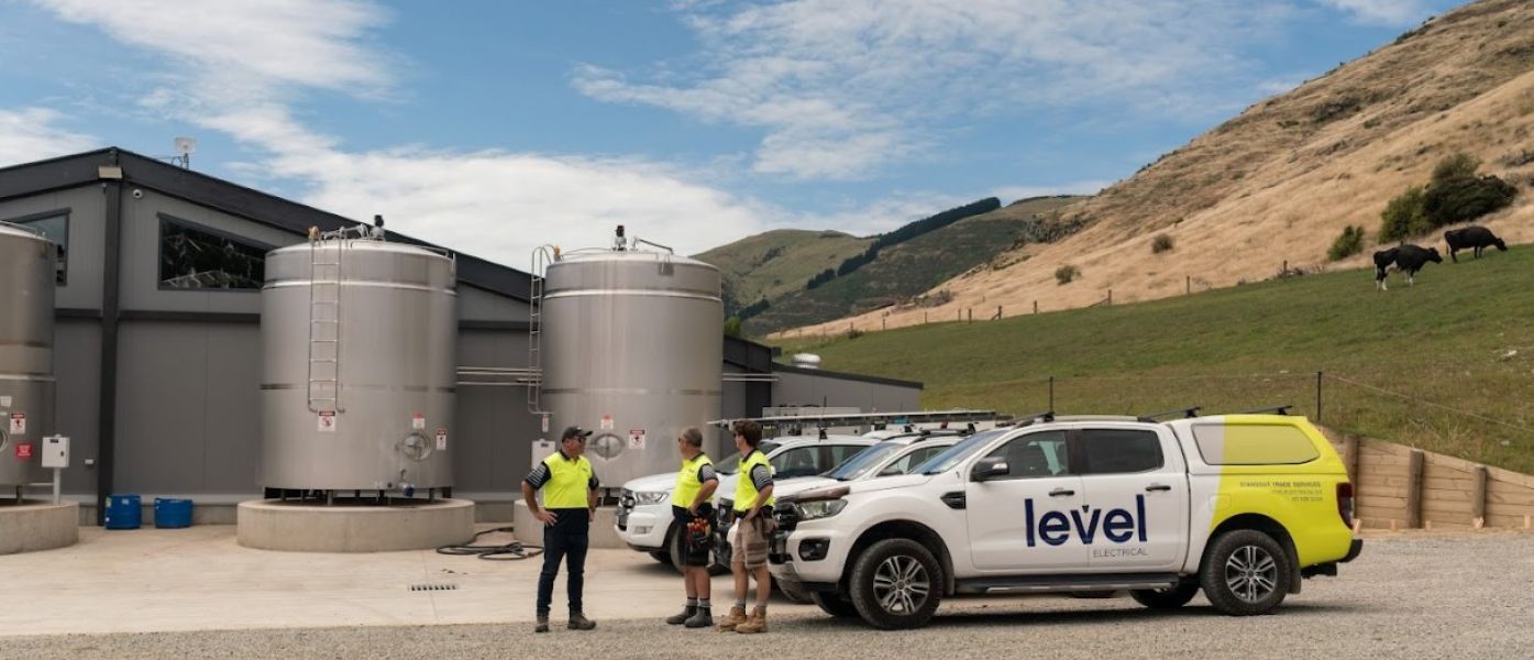 Level Electrical Ashburton team and vehicles at Wongan Hills dairy shed installation in Banks Peninsula