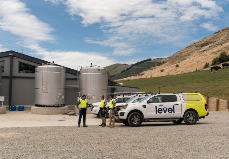 Level Electrical Ashburton team and vehicles at Wongan Hills dairy shed installation in Banks Peninsula