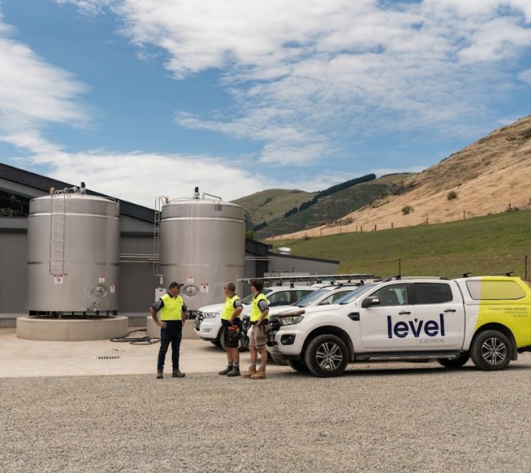 Level Electrical Ashburton team and vehicles at Wongan Hills dairy shed installation in Banks Peninsula