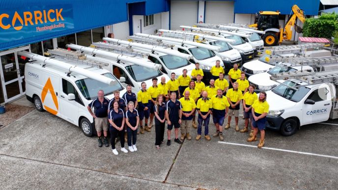 Team and service vehicles at Carrick Plumbing & Roofing in Port Macquarie, part of the Level Group ANZ alliance