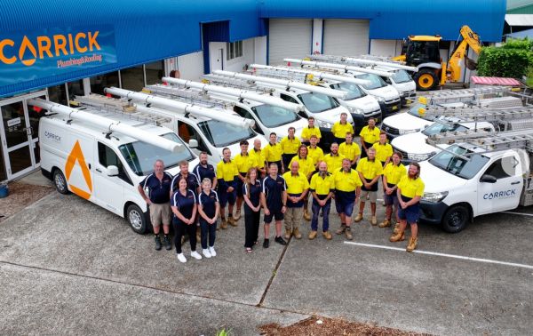 Team and service vehicles at Carrick Plumbing &amp;amp;amp;amp;amp;amp; Roofing in Port Macquarie, part of the Level Group ANZ alliance