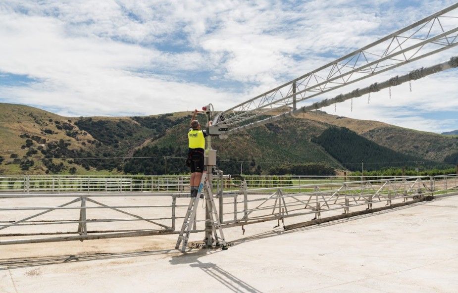 Technician working on rotary dairy system structure at Wongan Hills dairy shed in Banks Peninsula