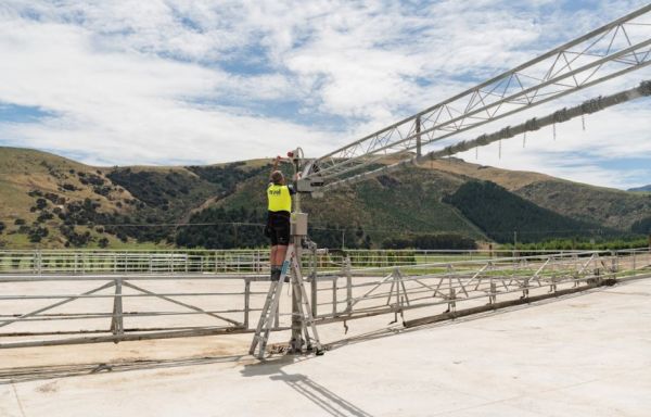 Technician working on rotary dairy system structure at Wongan Hills dairy shed in Banks Peninsula
