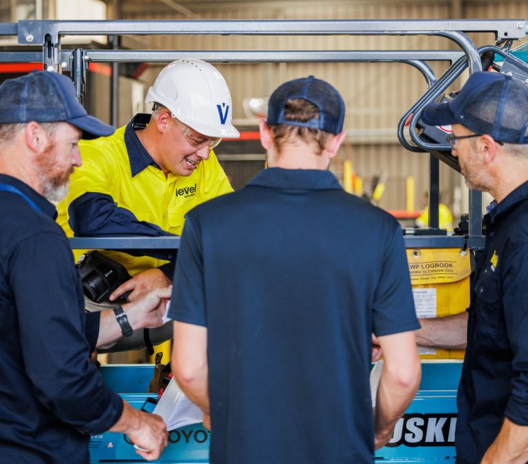Level Electrical team members working together on-site, showcasing the collaboration and expertise behind Level’s electrical and plumbing services in New Zealand